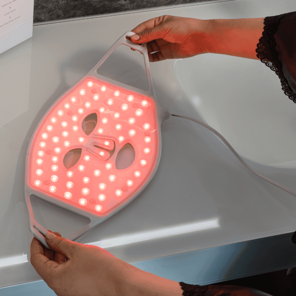 Silver Series 1 LED mask by CurrentBody Skin, showing the sleek silver design with multiple LED light panels for facial treatment.