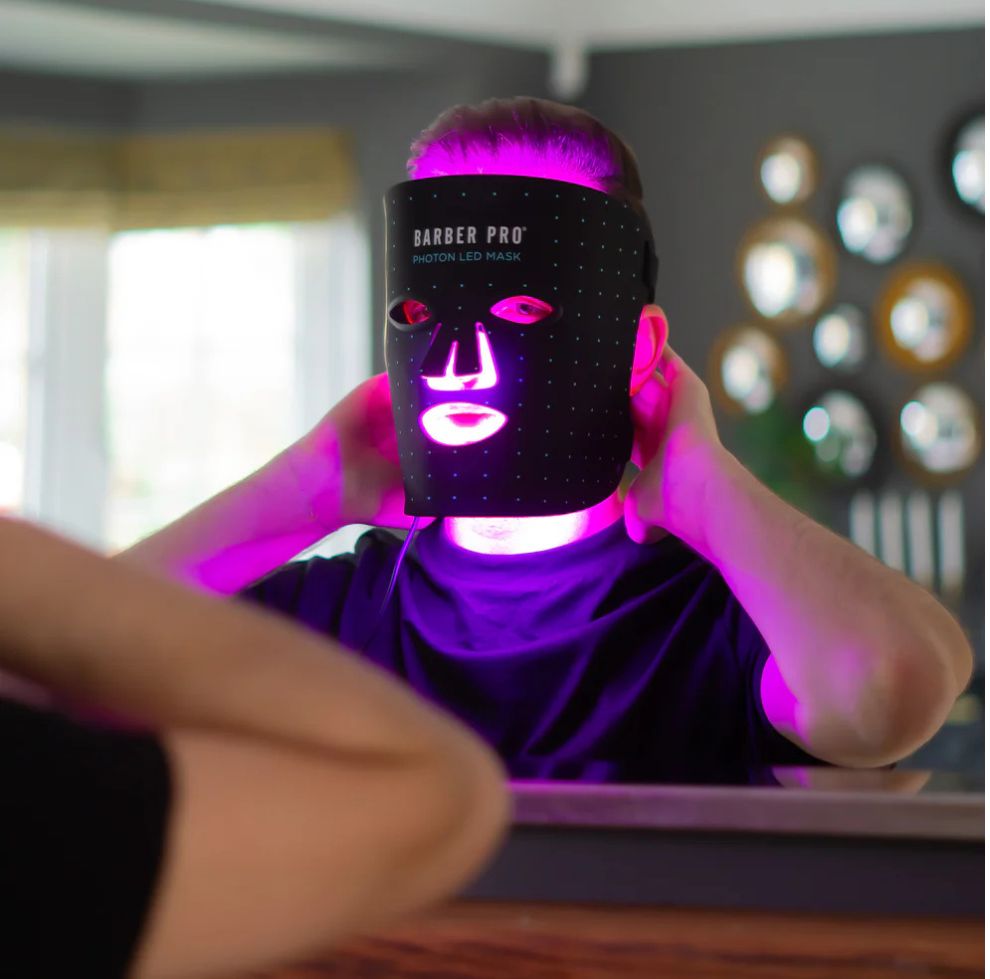 Yolaine Barber Pro Photon LED light therapy facial mask for men with adjustable straps and multiple LED light panels for skin rejuvenation.