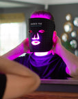 Yolaine Barber Pro Photon LED light therapy facial mask for men with adjustable straps and multiple LED light panels for skin rejuvenation.
