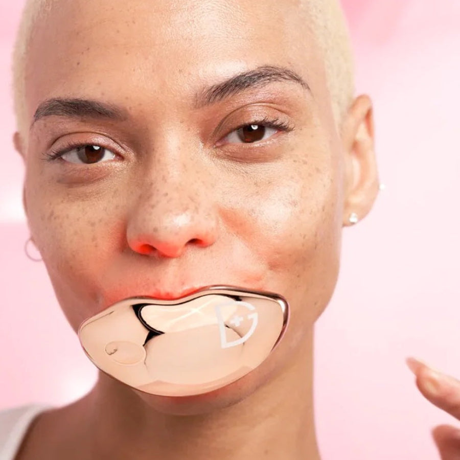 Dr. Dennis Gross DrX Spectralite Lipware Pro device with LED light therapy for lip skincare, shown in a close-up image.