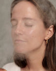 Yolaine Dr. Dennis Gross Pro Facial Steamer device with a sleek design, ready for at-home skincare and facial steaming.