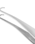 Yolaine Tweezerman blackhead extractor tool with stainless steel tip for safe pore extraction and skincare.