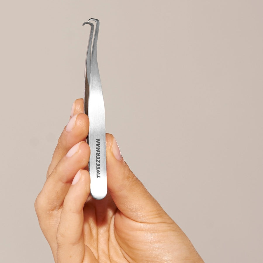 Yolaine Tweezerman blackhead extractor tool with stainless steel loop for safe pore pore extraction and skin cleansing.
