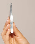 Yolaine Tweezerman blackhead extractor tool with stainless steel loop for safe pore pore extraction and skin cleansing.