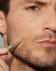 Tweezerman Essential Grooming Kit with precision tweezers, scissors, and tools for grooming and personal care.