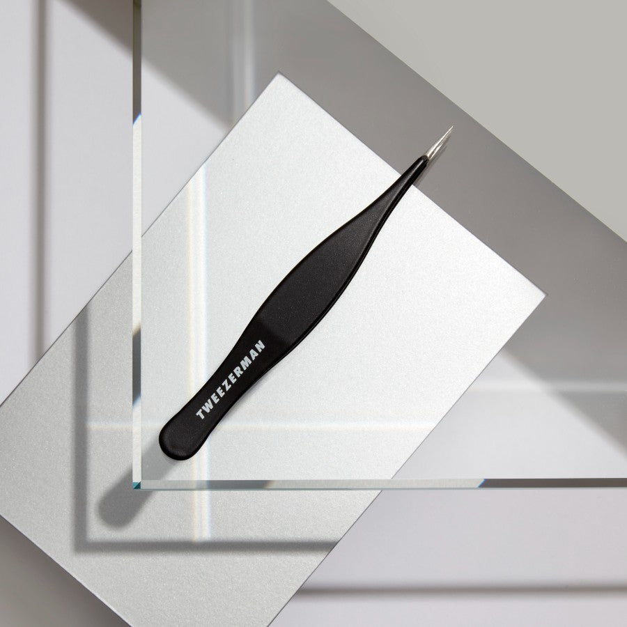 Yolaine Tweezerman ingrown hair and splinter tweezers with precision tips for safe hair removal and splinter extraction.