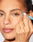 Yolaine Tweezerman Mini Slant Tweezer in Bahama Blue with precise slant tips for brow shaping and grooming.