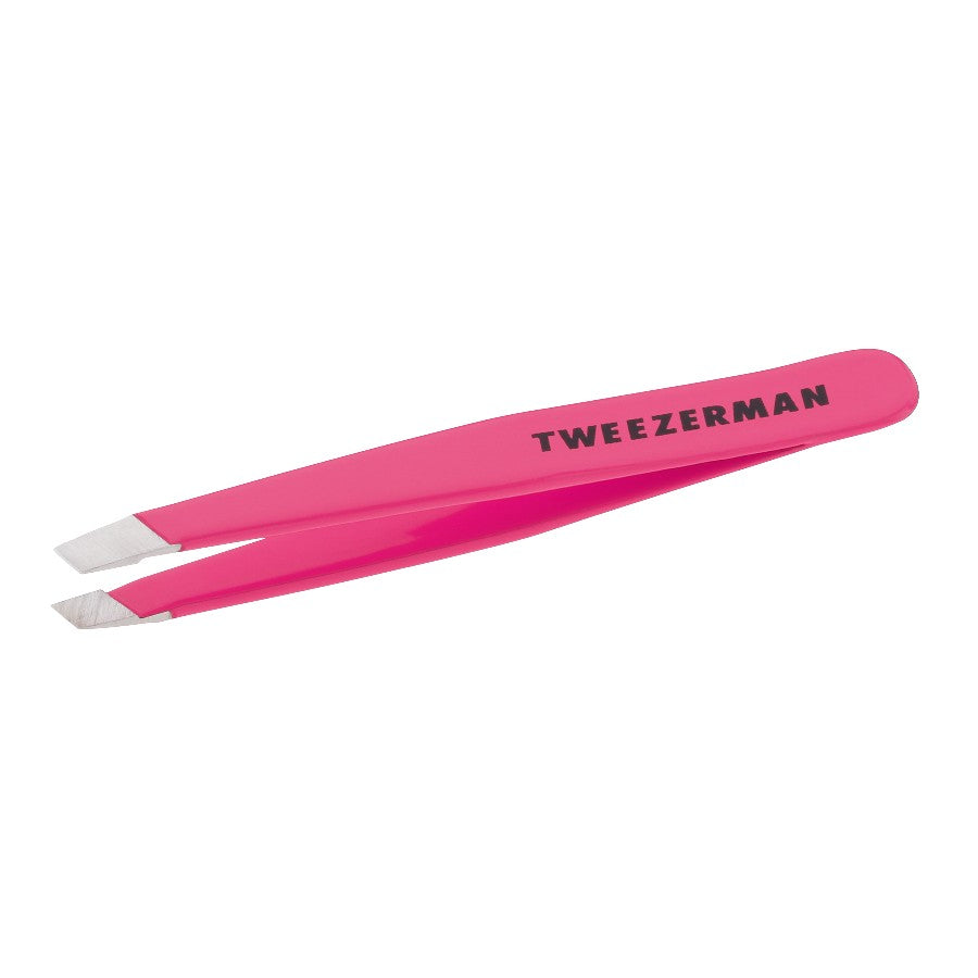 Pink Tweezerman Mini Slant Tweezer by Yolaine with precise slant tip for eyebrow grooming and detail plucking.