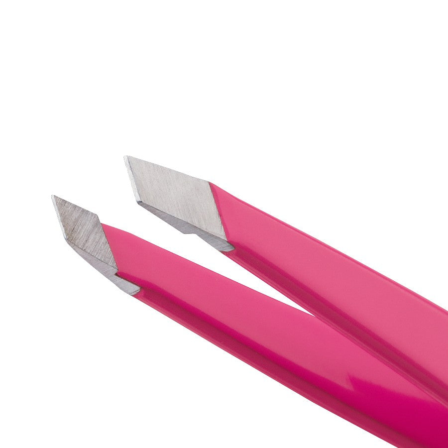 Yolaine Tweezerman Mini Slant Tweezer in pink with precise slanted tips for grooming eyebrows and facial hair.