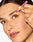 Pink Tweezerman Mini Slant Tweezer with precision slant tips for tweezer grooming and eyebrow shaping.