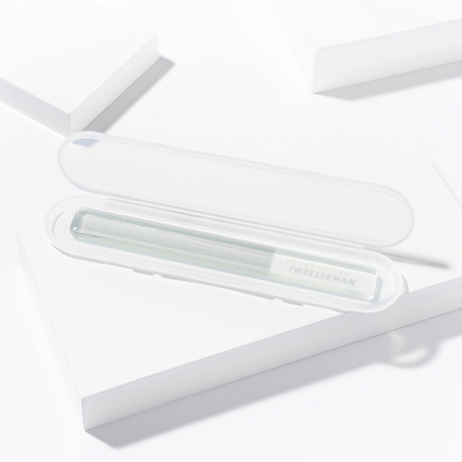 Yolaine Tweezerman reusable glass nail buffer with textured surface for smooth, polished nails.