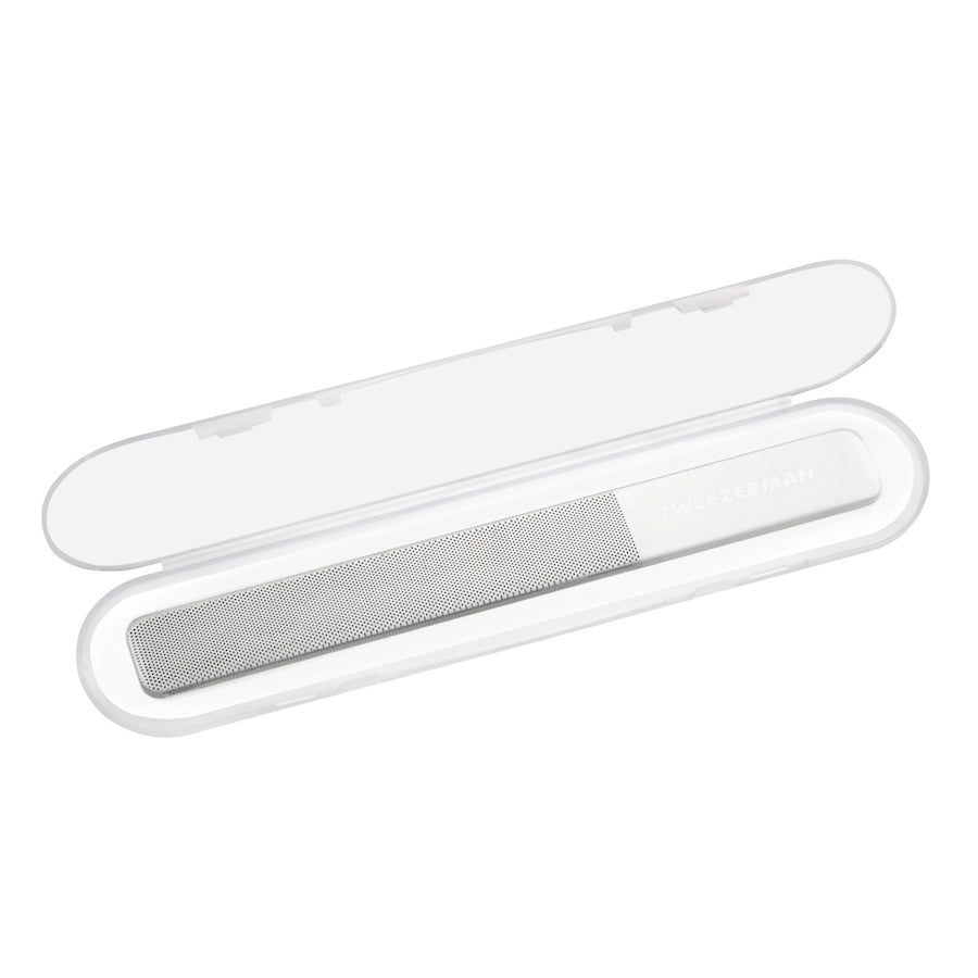 Yolaine Tweezerman reusable glass nail buffer with smooth and textured sides for polishing and shaping nails.