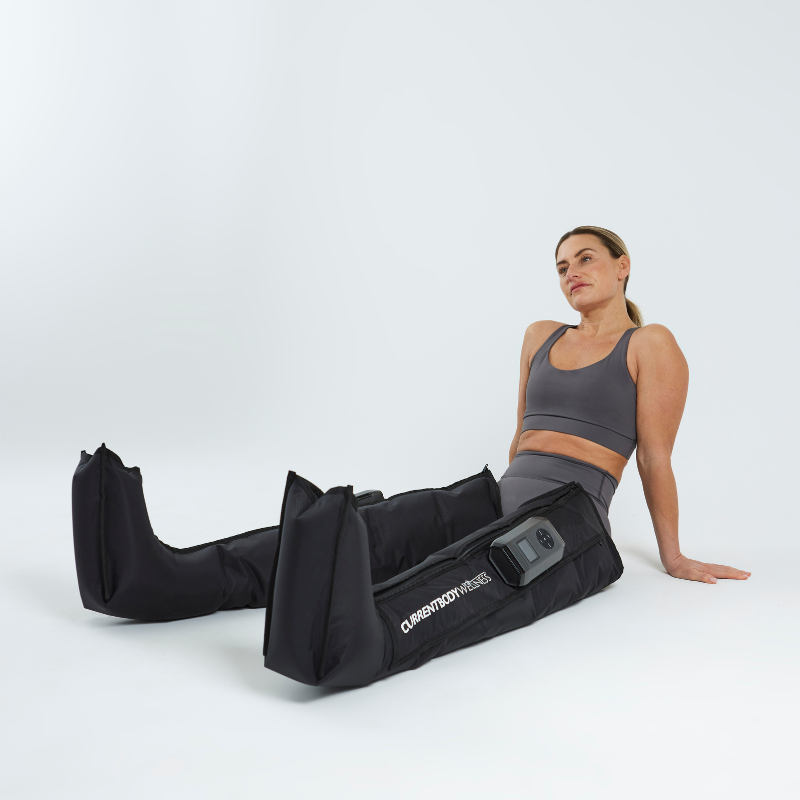 CurrentBody Skin wellness sauna blanket and recovery compression boots, showing the boots with open design and adjustable straps.