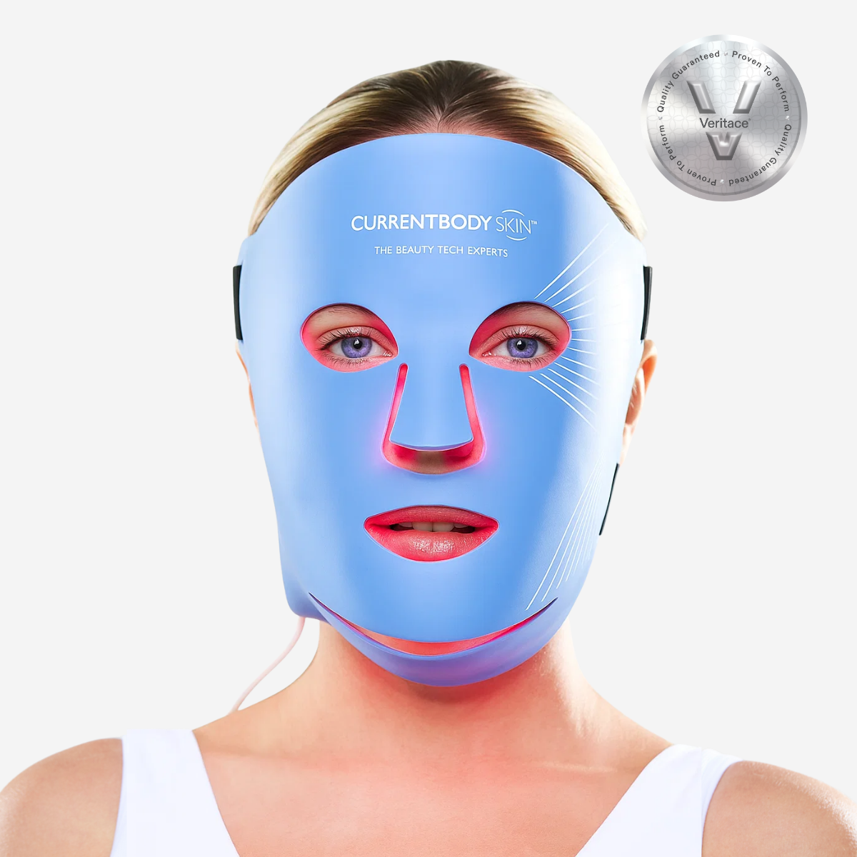 CurrentBody Skin LED blue light therapy face mask worn on a person's face, promoting skin rejuvenation and acne treatment.