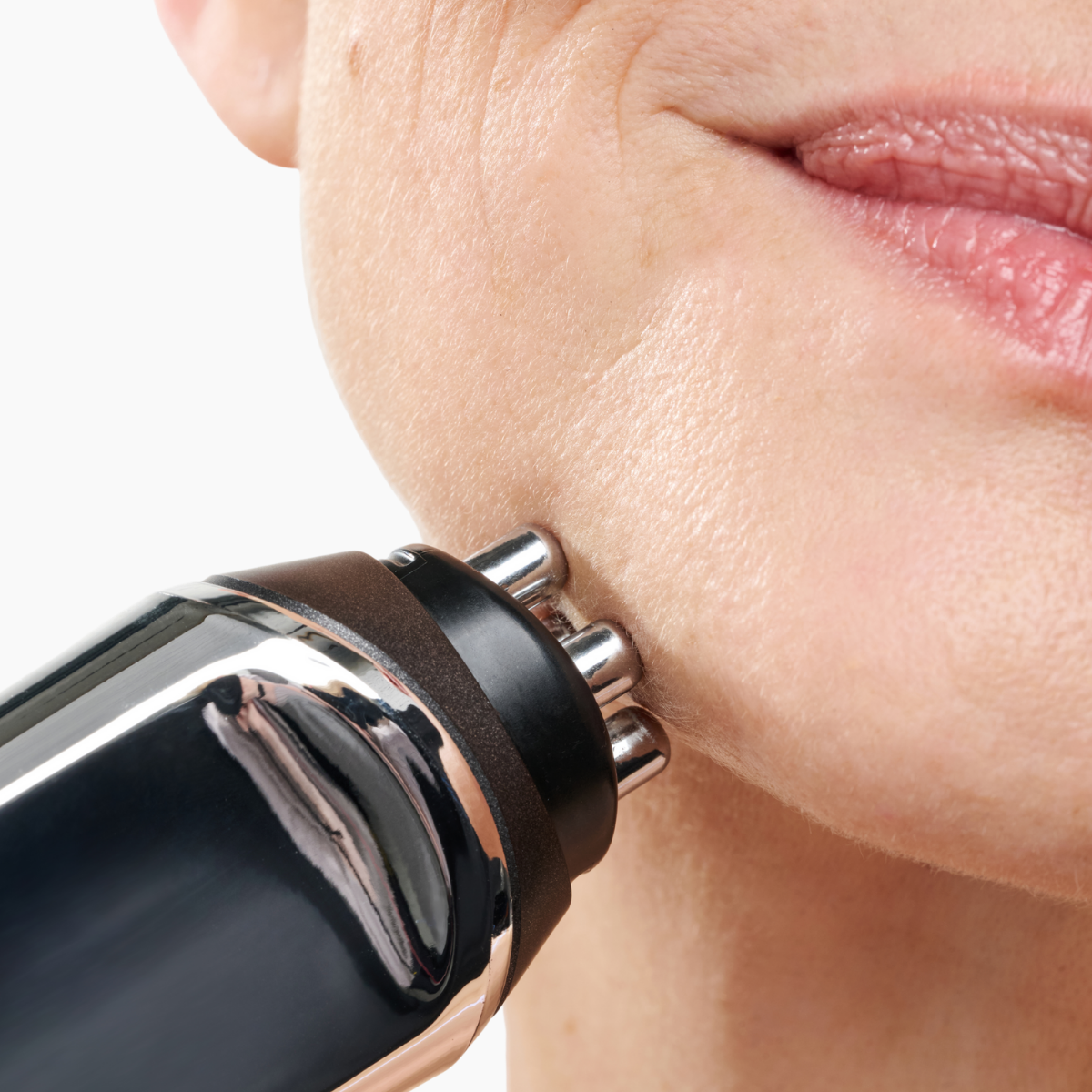 CurrentBody Skin RF Radio Frequency Skin Tightening Device held in hand, showcasing its sleek design for non-invasive skin tightening.