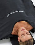CurrentBody Skin Infrared Sauna Blanket spread open, showing its soft fabric exterior and control panel for relaxing infrared therapy.