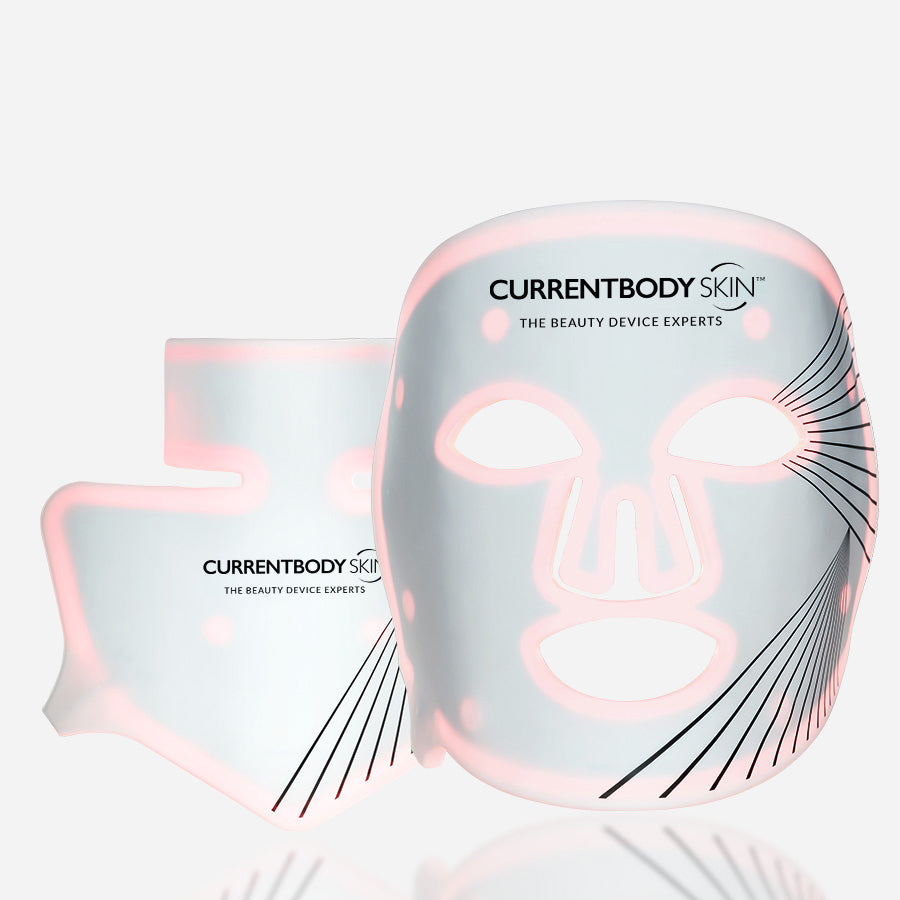 CurrentBody Skin LED Red Light Therapy Face Mask shown on a model, highlighting its adjustable straps and full-face coverage for skincare.