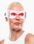 CurrentBody Skin LED eye mask shown in a close-up, featuring a sleek black design with adjustable straps for targeted eye treatment.