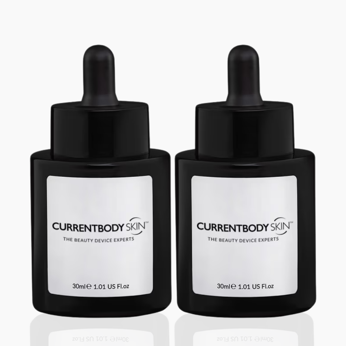 CurrentBody Skin Green Tea Serum 30ml bottle with pump dispenser, featuring a sleek green and white label on a clear glass container.