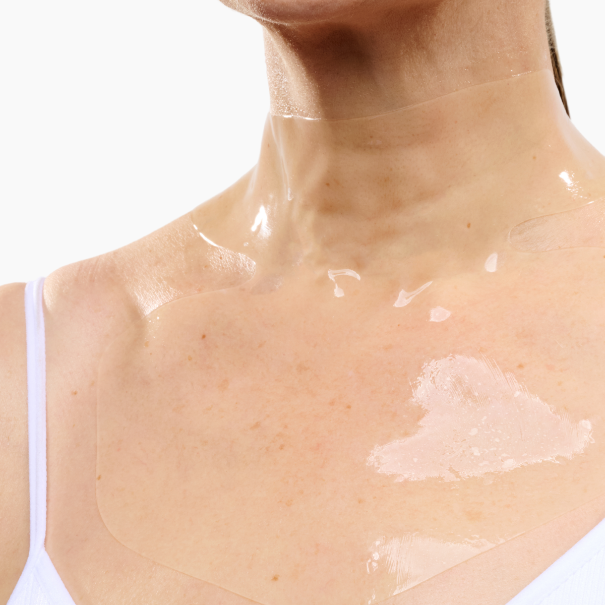 CurrentBody Skin Hydrogel Neck and Décolletage Mask shown on a model's neck and décolletage area for skin hydration and firming.