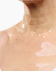 CurrentBody Skin Hydrogel Neck and Décolletage Mask shown on a model's neck and décolletage area for skin hydration and firming.