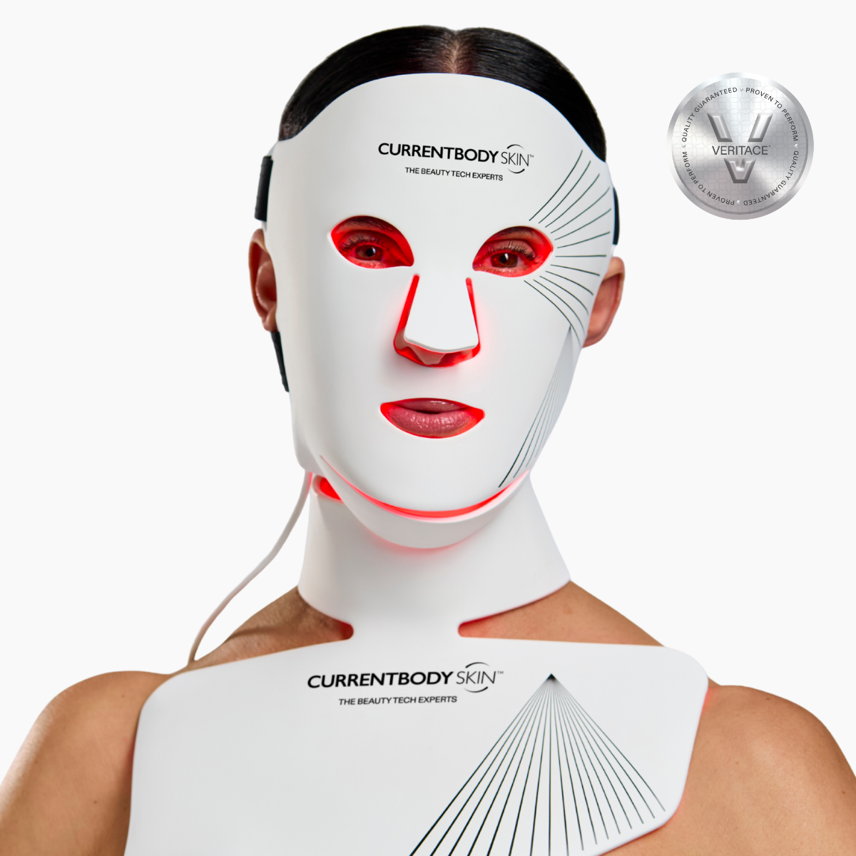CurrentBody Skin LED Face and Neck Kit Series 2 showing the device emitting red light on a person's face and neck.