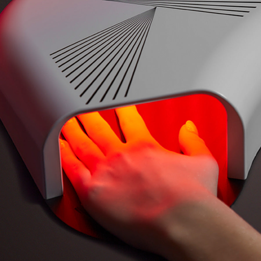 CurrentBody Skin LED hand mask in use, showcasing a wearable device for skin treatment on the hands.