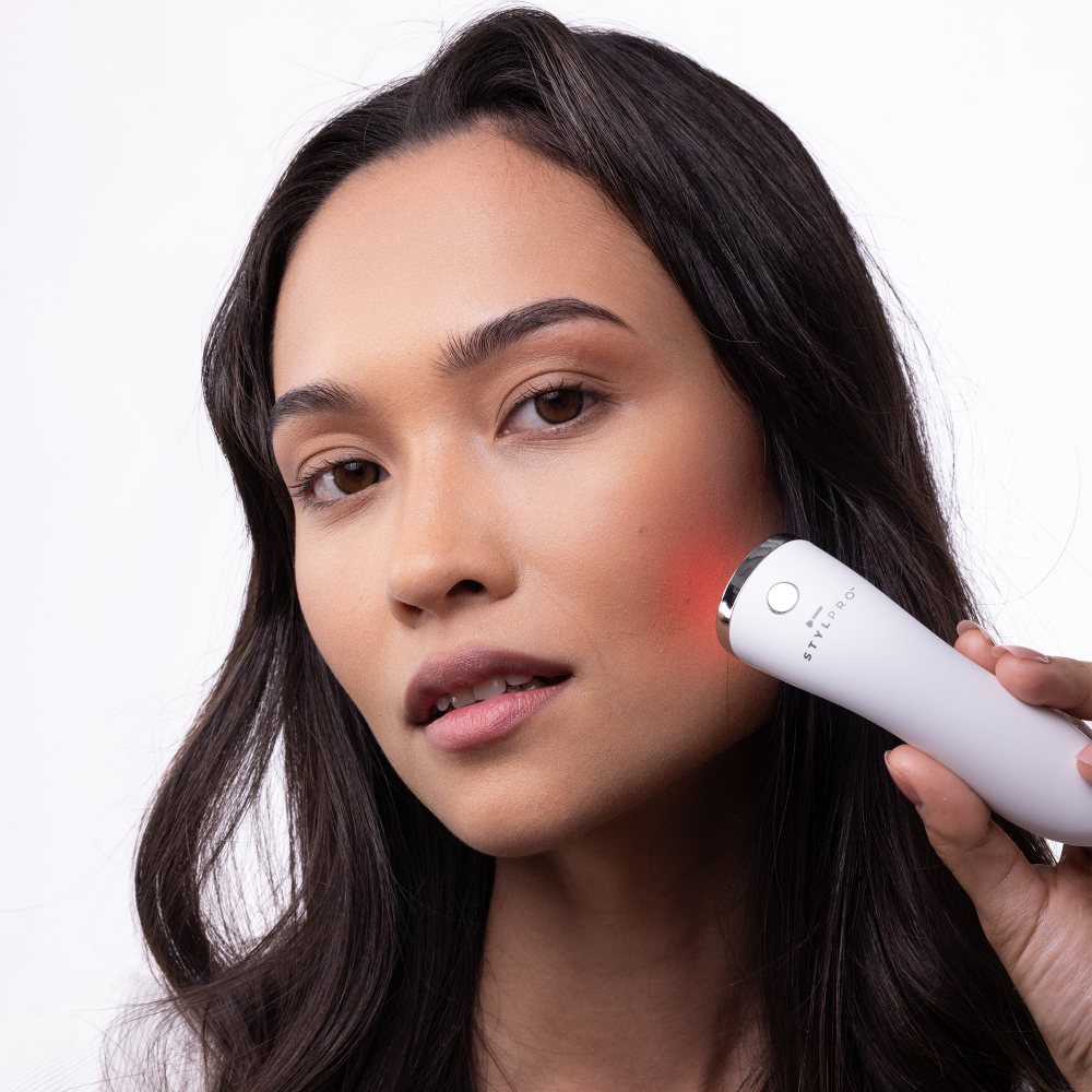 LEDMASKCONCEPT StylPro Mini LED Wand emitting bright, colorful light for skincare and beauty treatments.