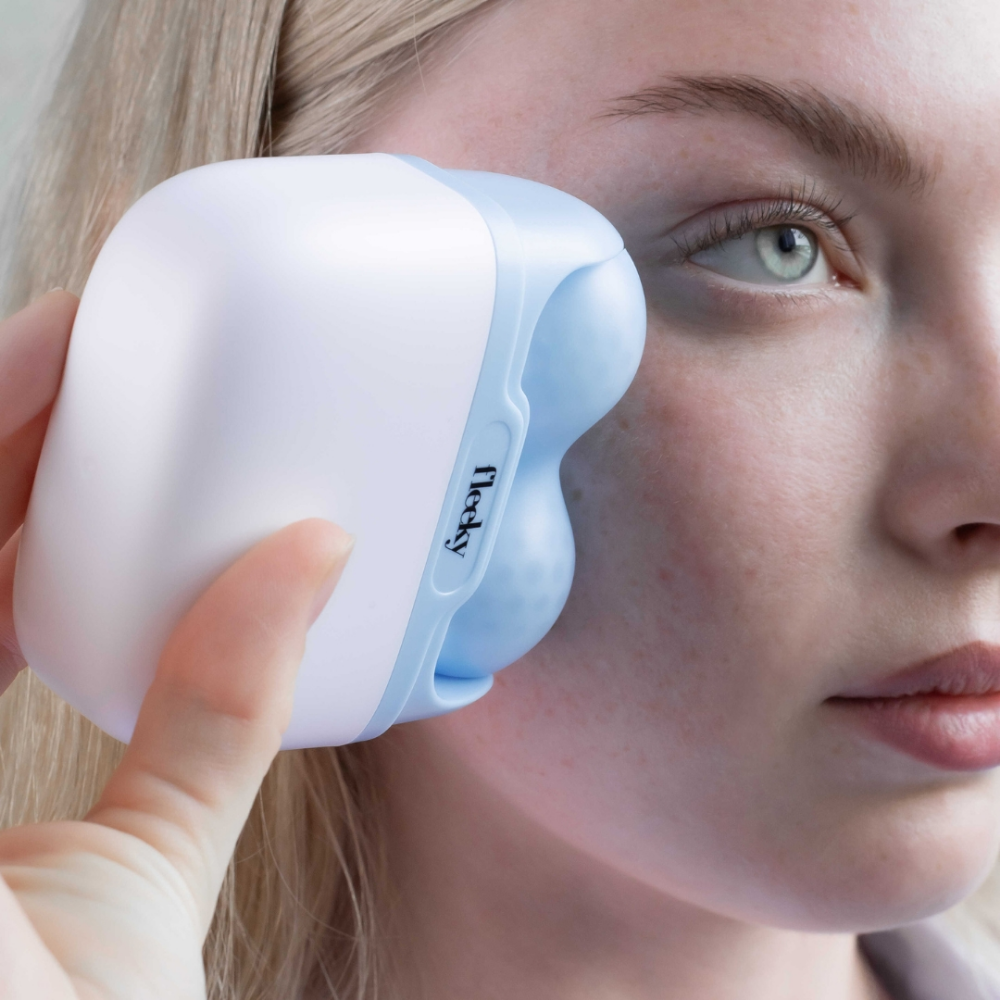 Fleeky Facial Ice Roller by LEDMASKCONCEPT, showing the sleek, handheld skincare tool with a cooling metal roller for facial massage.
