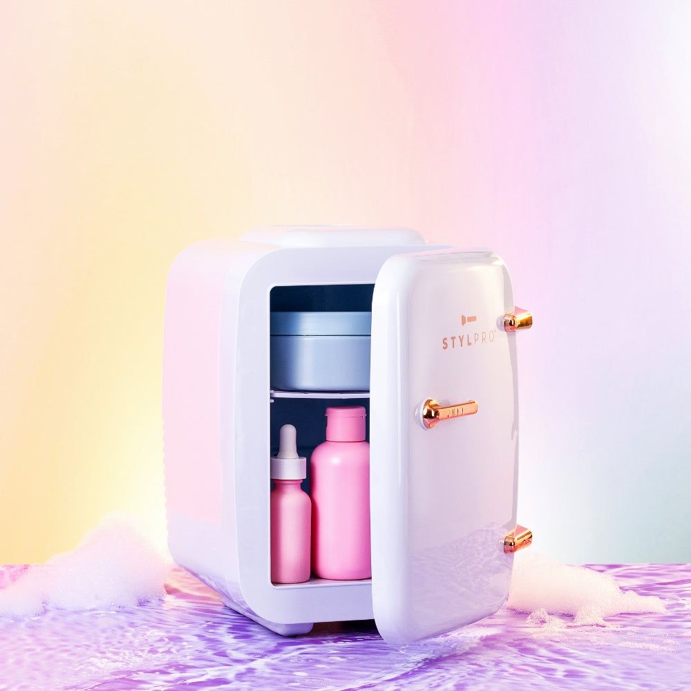 LEDMASKCONCEPT StylPro Beauty Fridge in elegant rose gold, compact design with a clear door and interior shelves for skincare storage.