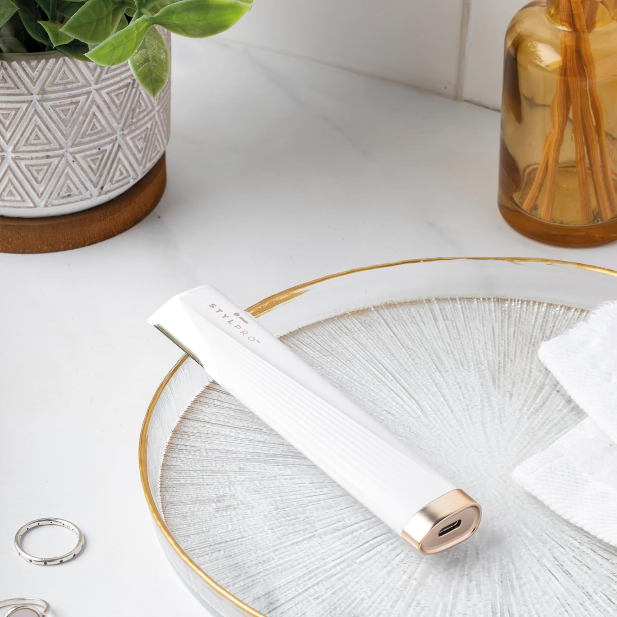 StylPro 2-in-1 Light Up Sonic Dermaplane and Trimmer from LEDMASKCONCEPT, showing the handheld device with lighted tip and accessories.