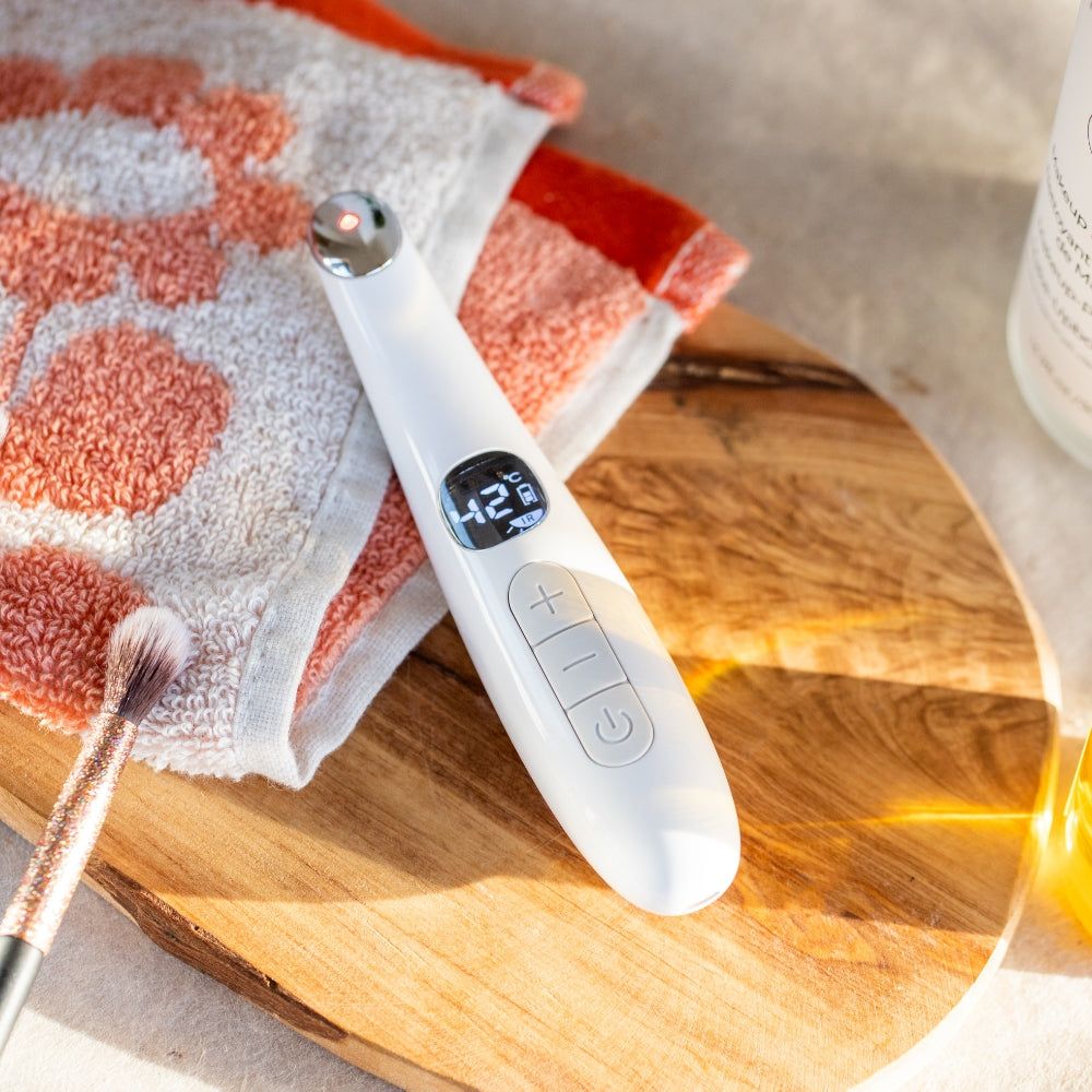 LEDMASKCONCEPT StylPro Bags Be Gone heated eye massager with ergonomic design and soft fabric for soothing eye relief.